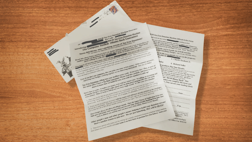 A photo of a printed scam-like marketing letter promoting a “$60 Tax-Free Donation Machine,” complete with cartoon rabbit and exaggerated claims.